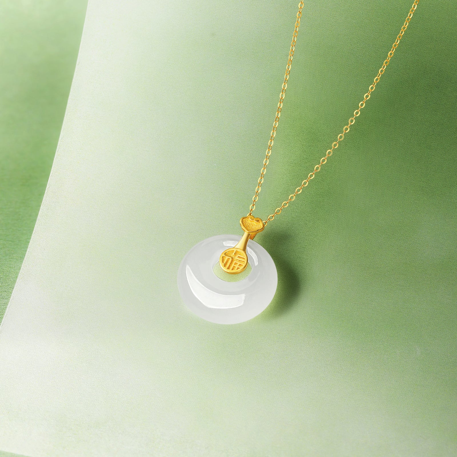 999.9 24K Gold Pendant Heitian Jade 0.8-1g Ping An Kou Y0411797